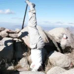 Edith Liu doing a headstand on Rouse Hill